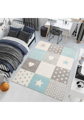 Bielo-tyrkysový koberec so vzormi